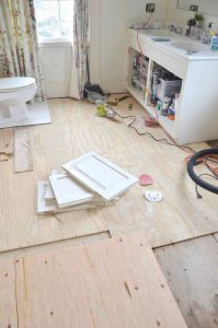 Working on the floor in the master bathroom.