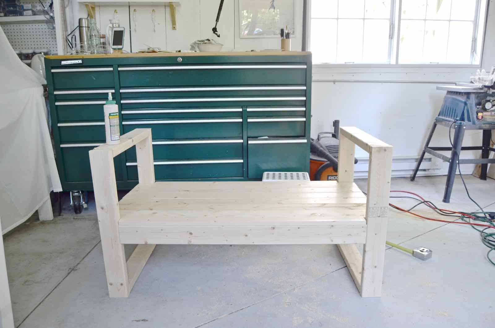 DIY bench made out of 2x4s with chic rope detail