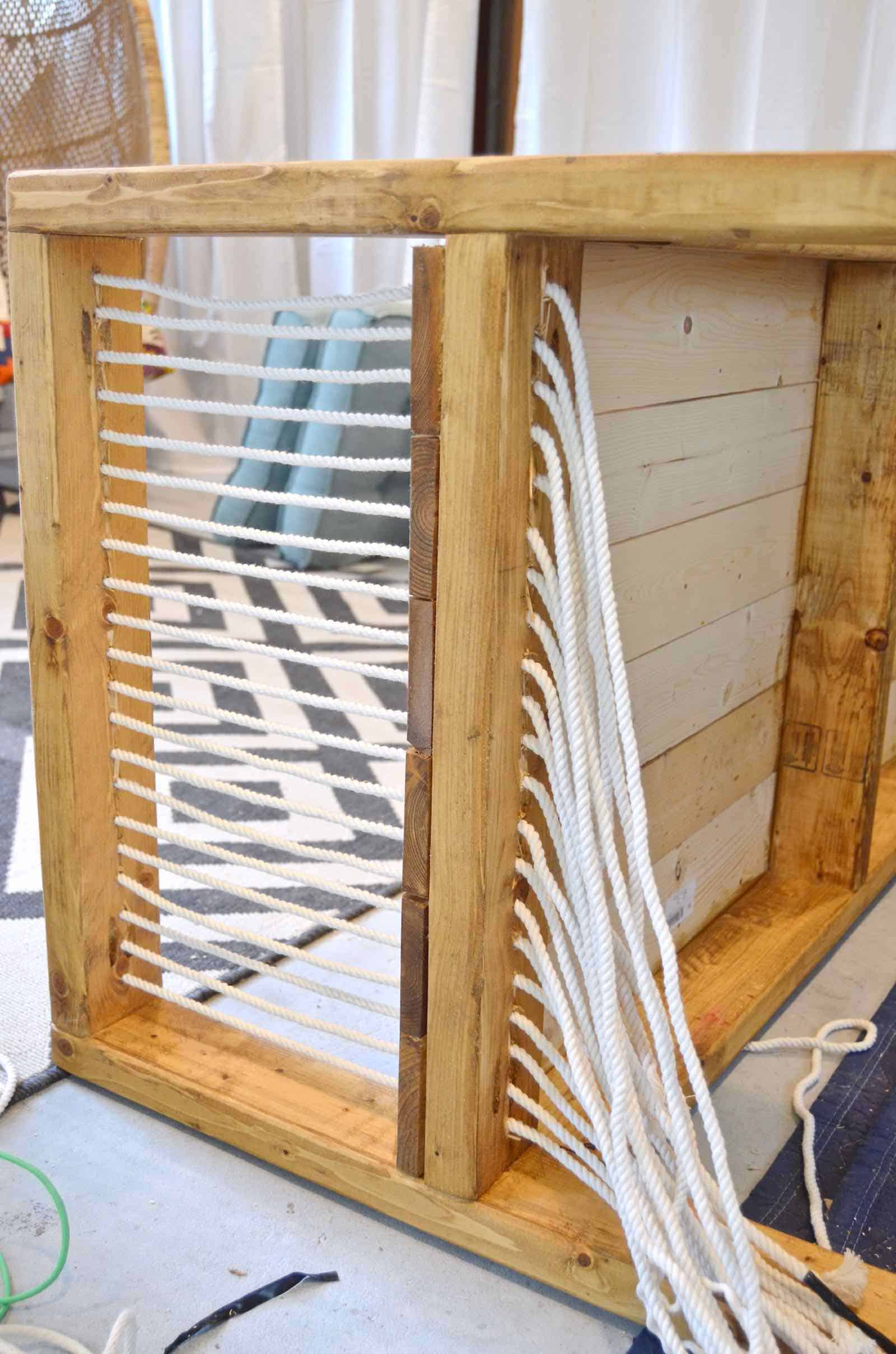 DIY bench made out of 2x4s with chic rope detail