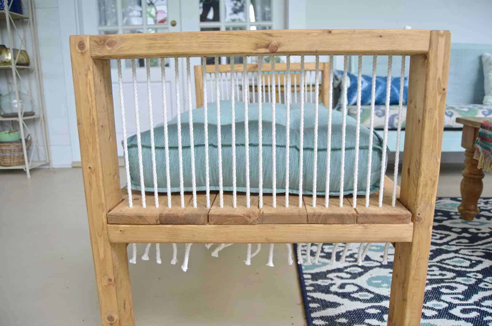 DIY bench made out of 2x4s with chic rope detail