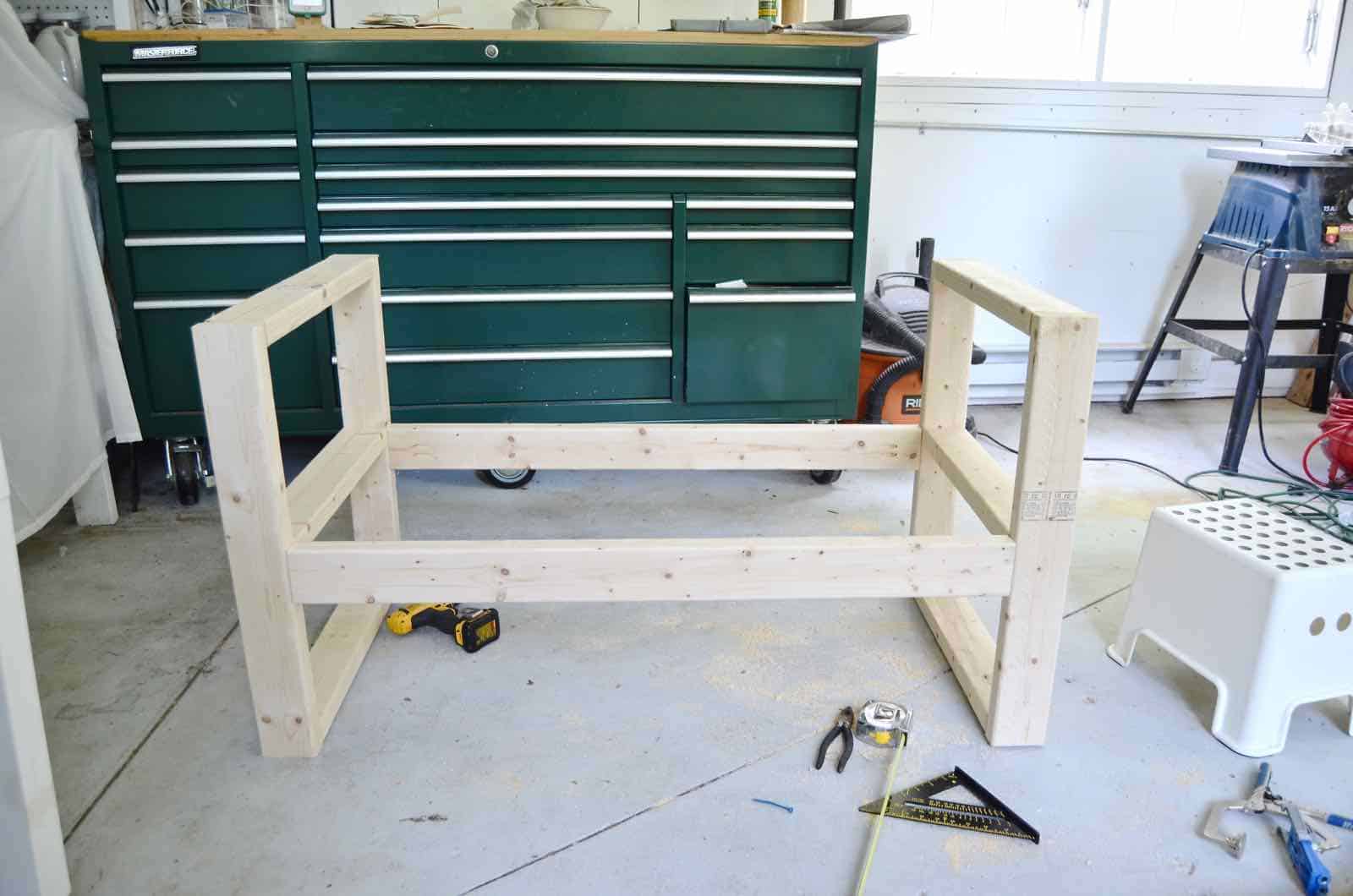 DIY bench made out of 2x4s with chic rope detail