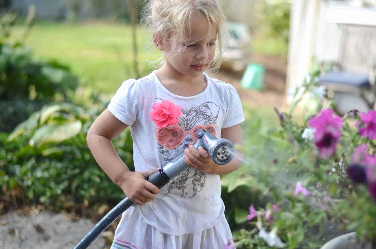 helping to water our plants