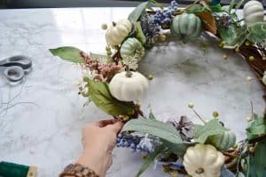 place flowers on wreath
