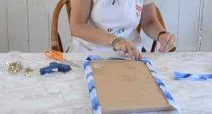 Cut the fabric larger than the cork board