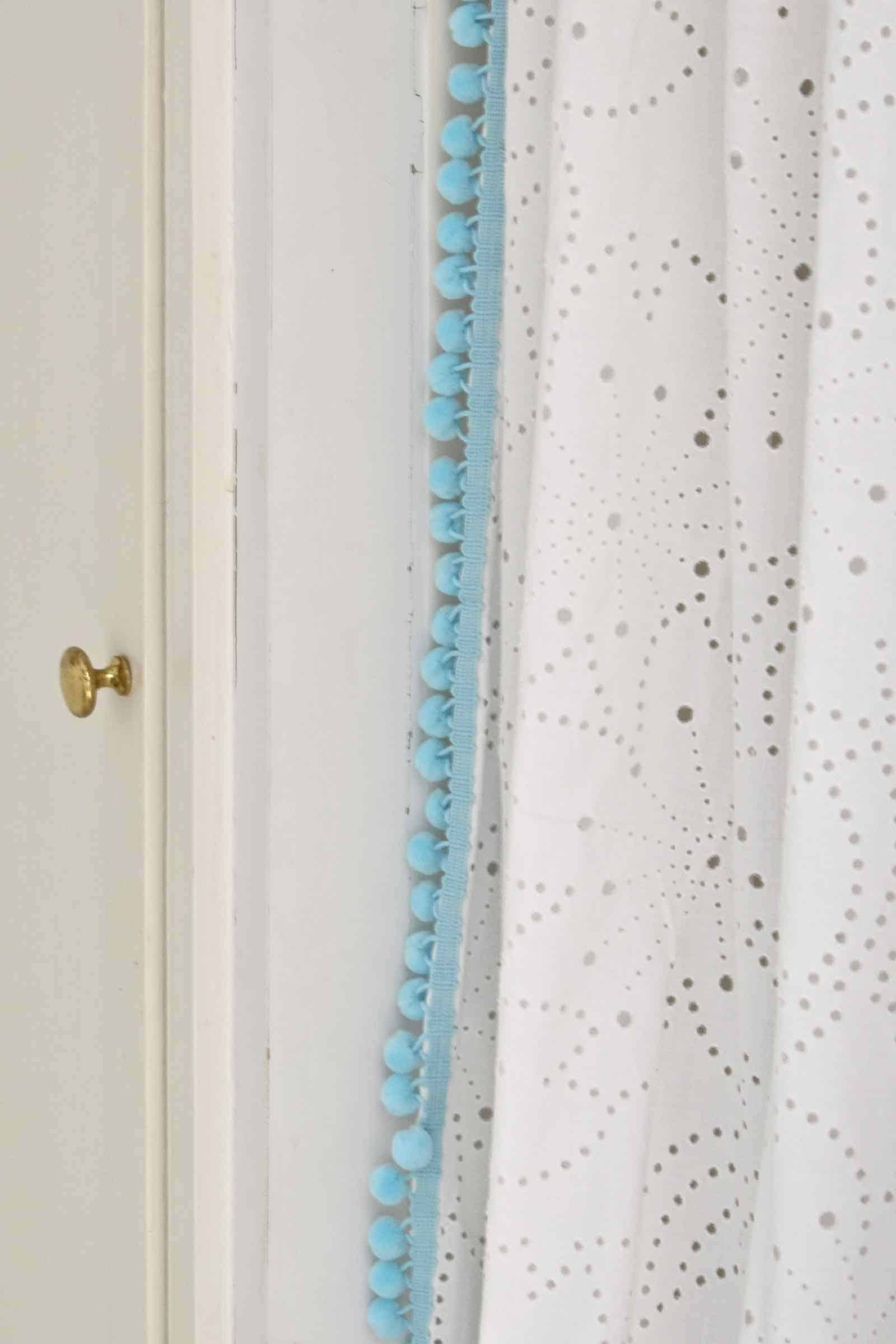 ball fringe on the shower curtain