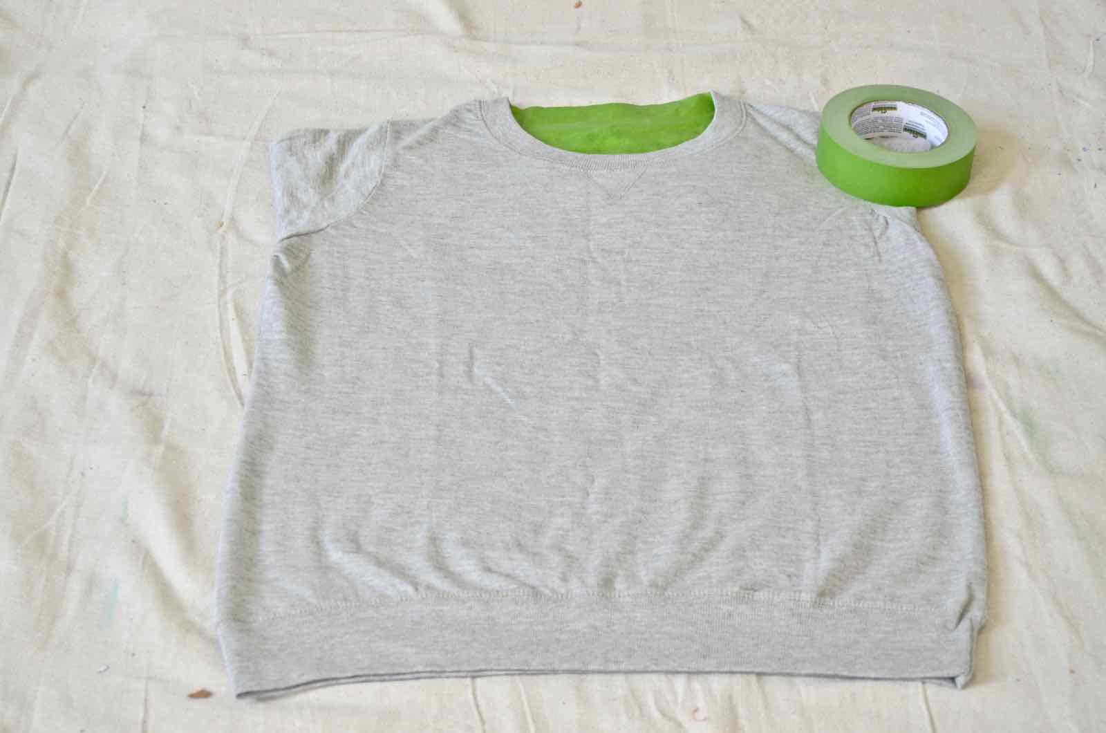 tape of sweatshirt for splatter painting