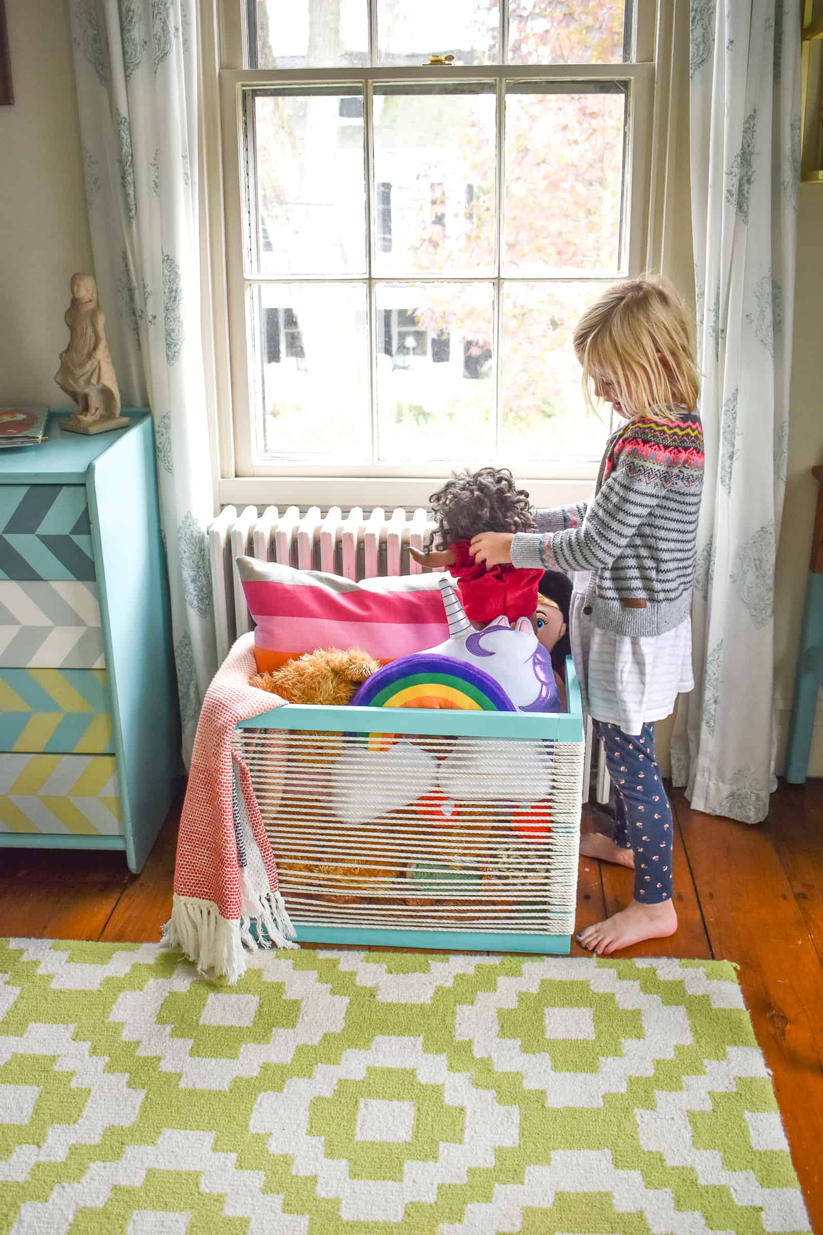 Martha with rope and wood storage bin