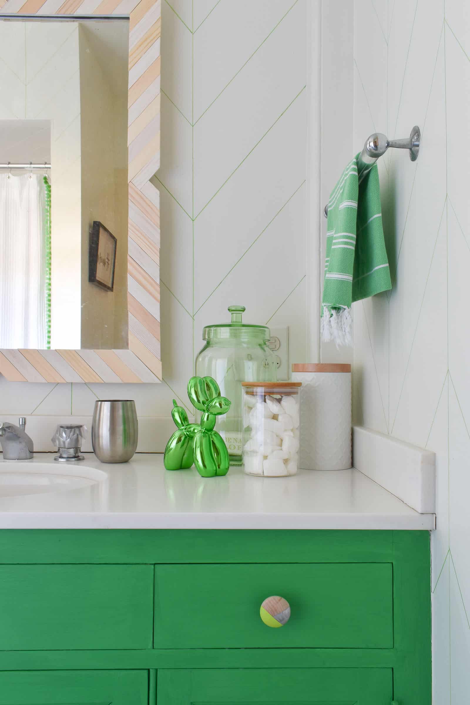 painted knob and vanity in budget bathroom