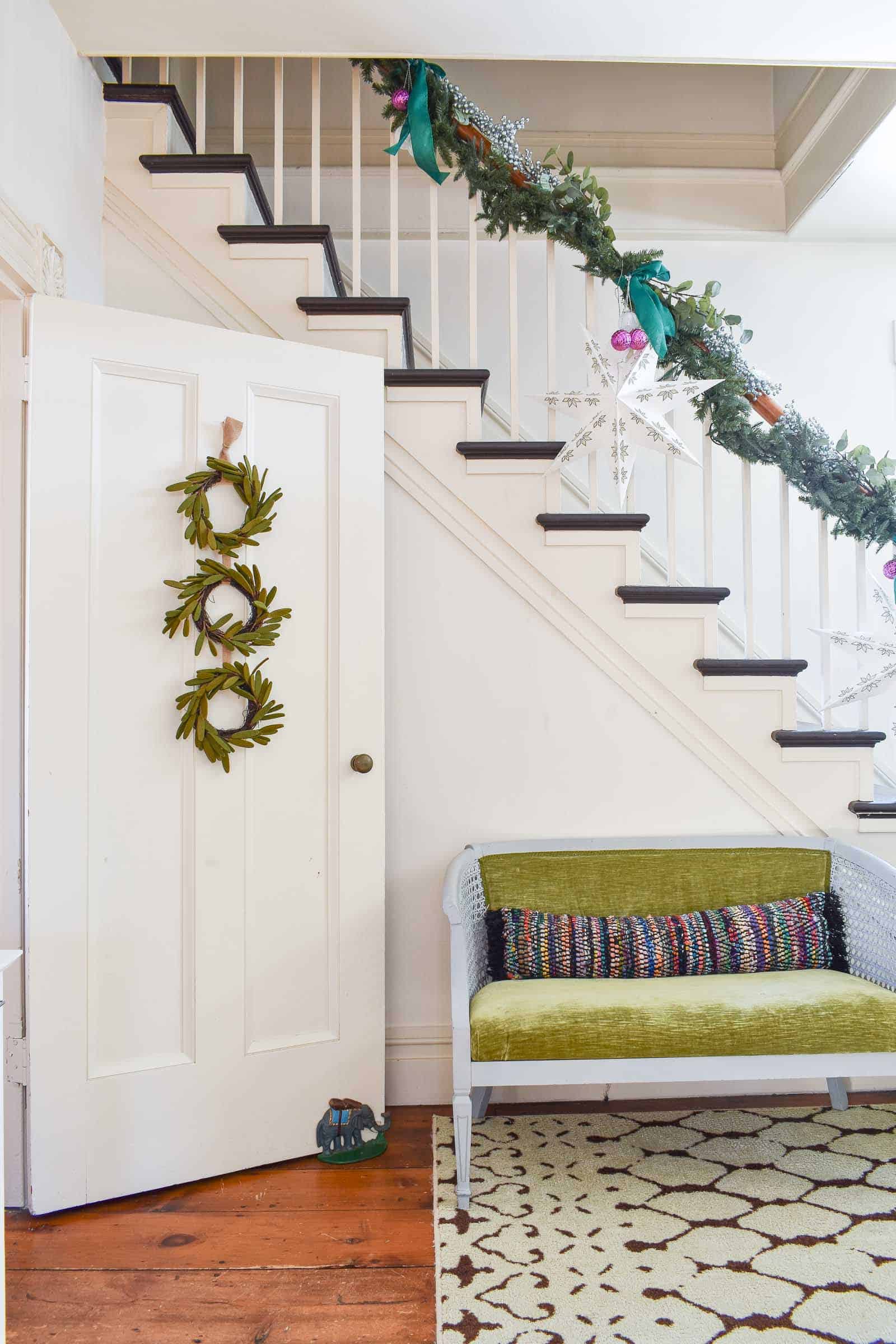 garland draped on banister in foyer