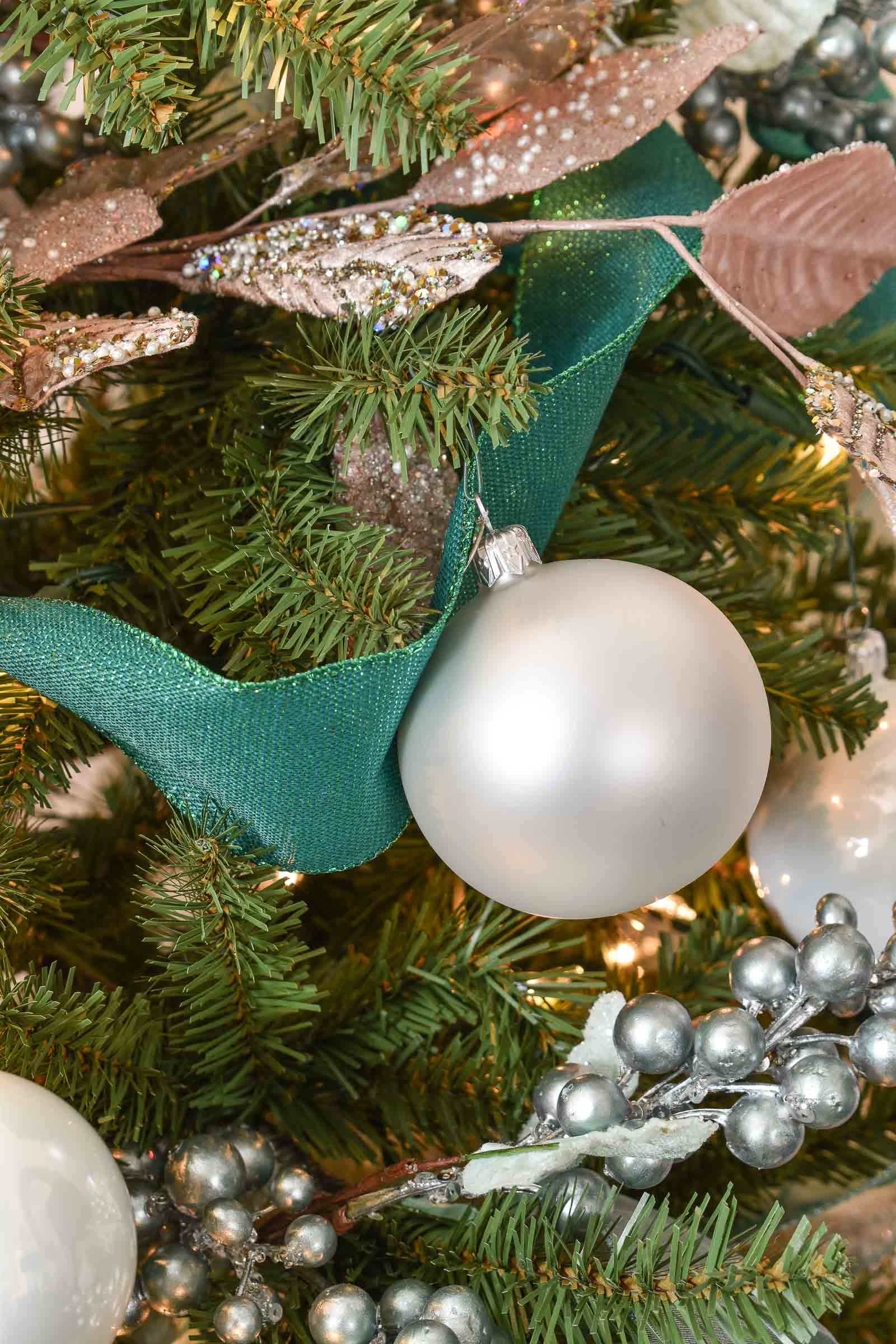 white ornaments on christmas tree