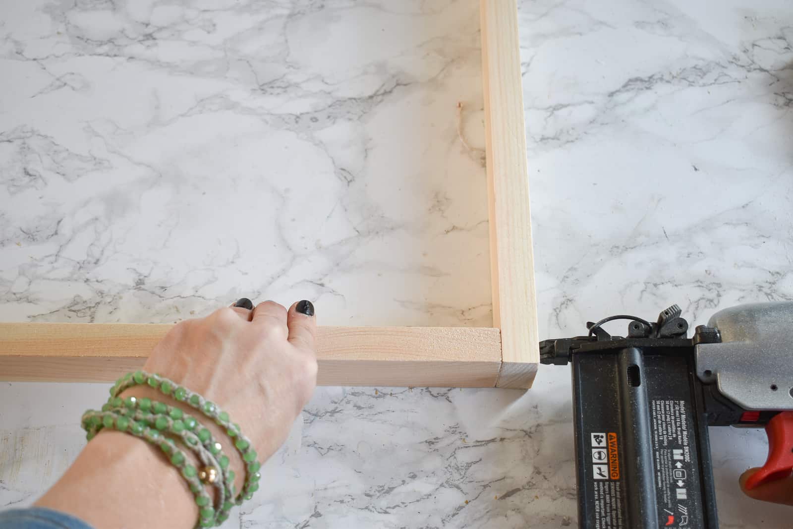 staple gun to build frames for christmas artwork