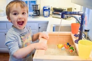 playing with toy sink