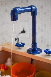 tubing through faucet for toy sink