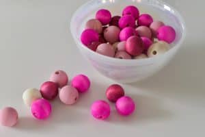 red and pink colored wooden beads