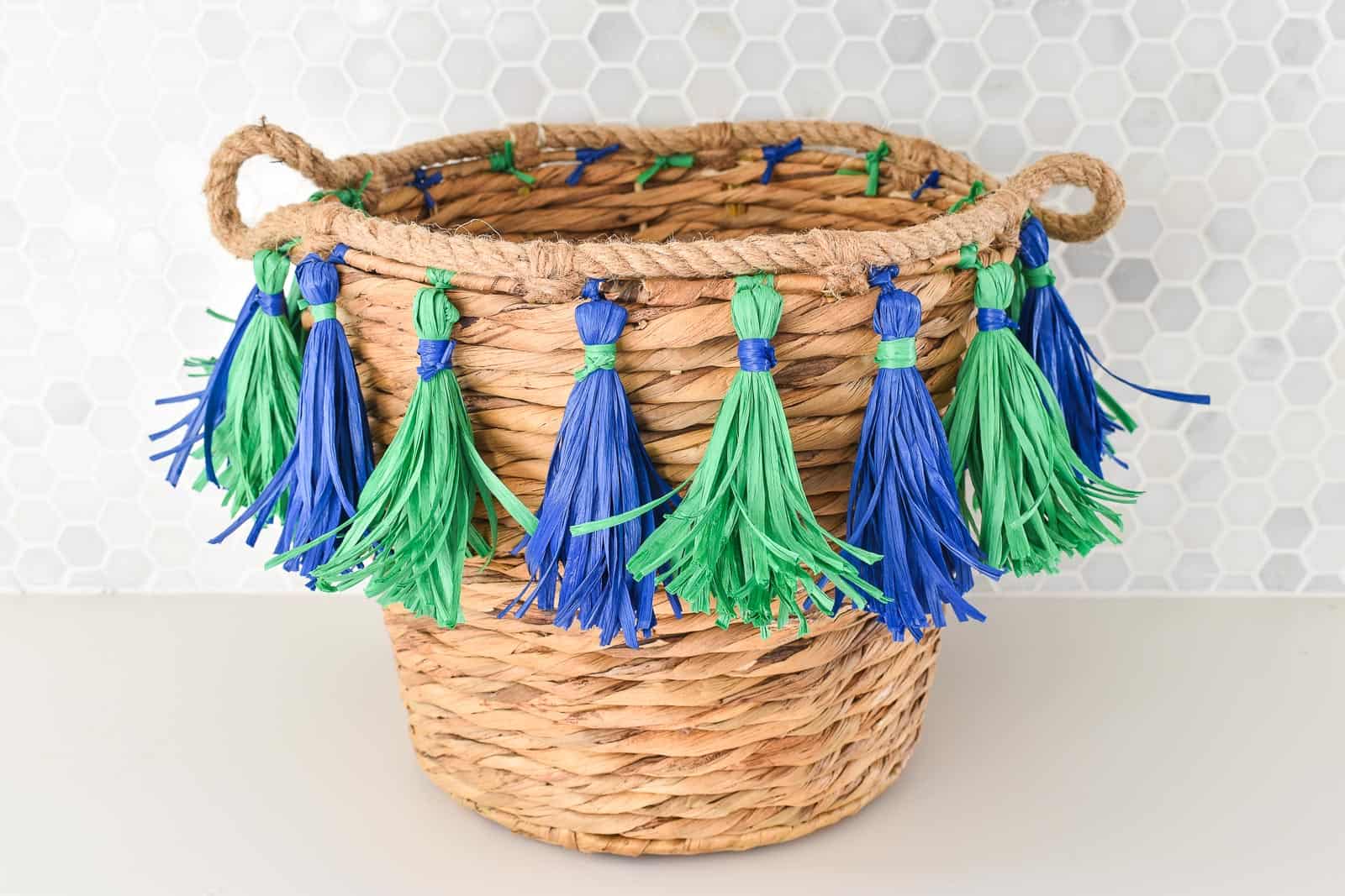 tie tassels onto basket