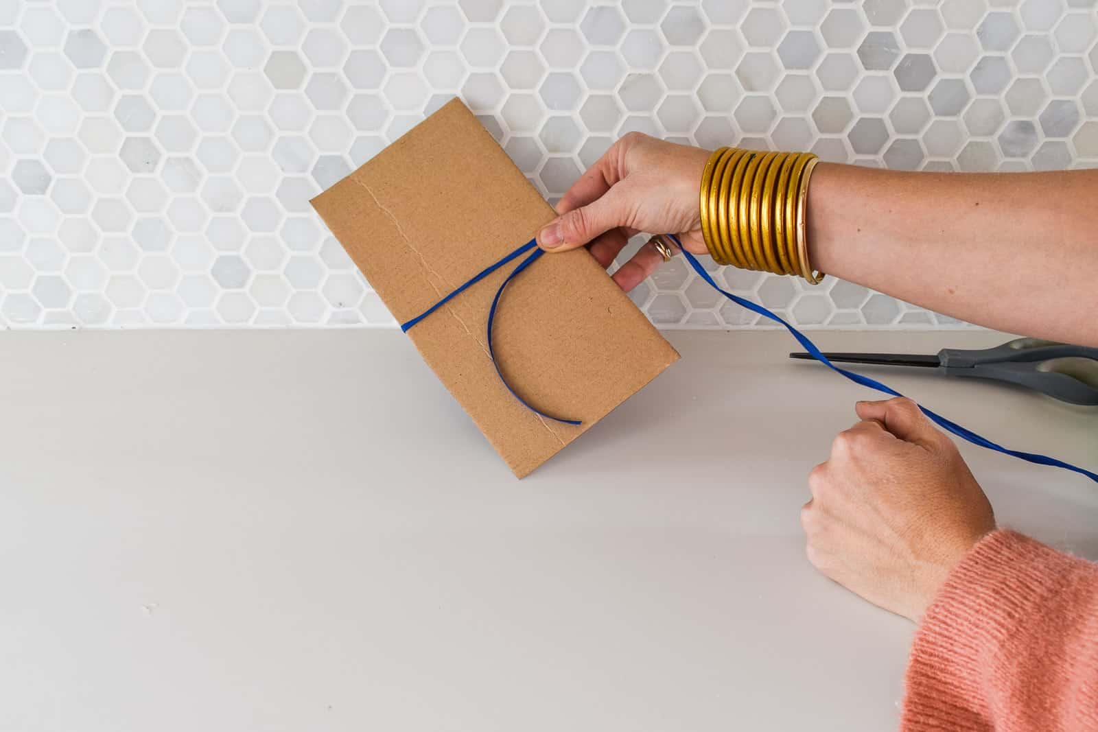 wrapping raffia around cardboard