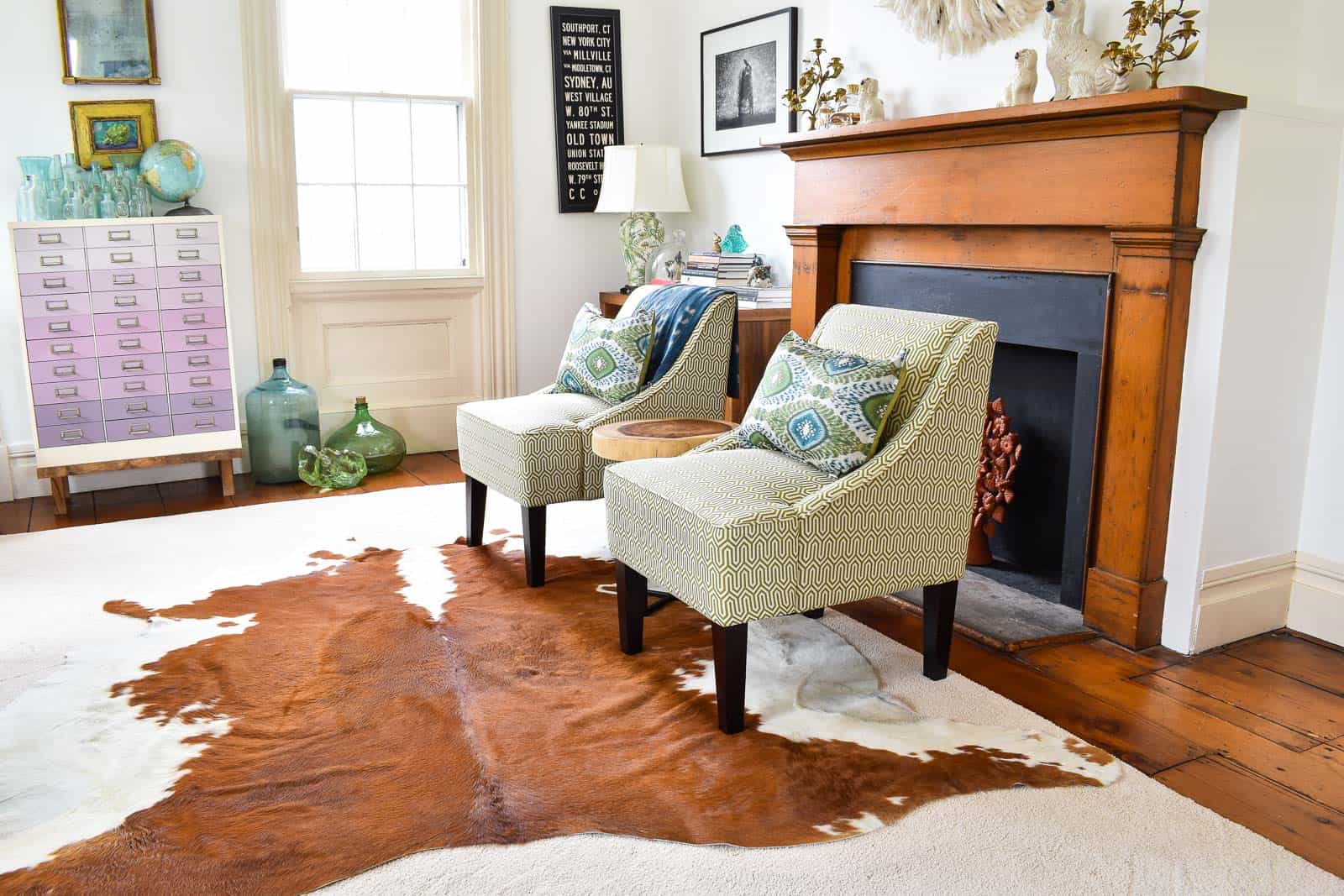 layered cowhide rug in office