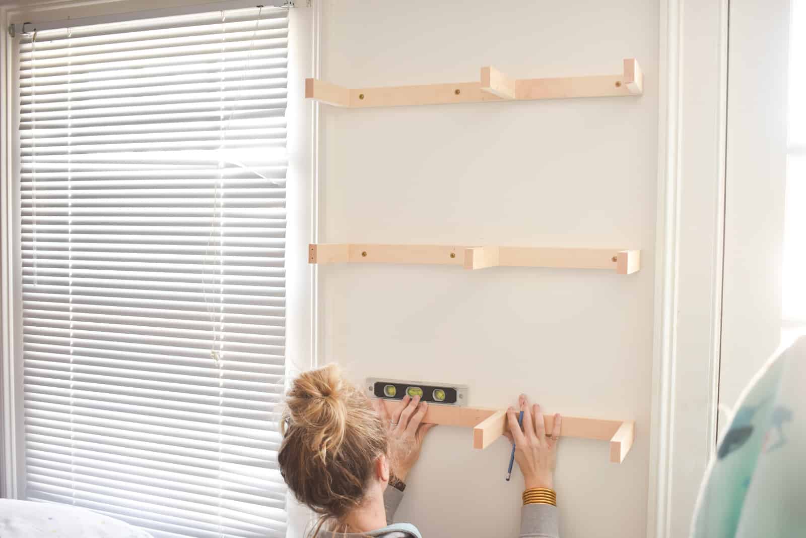 Attach all brackets to floating shelves