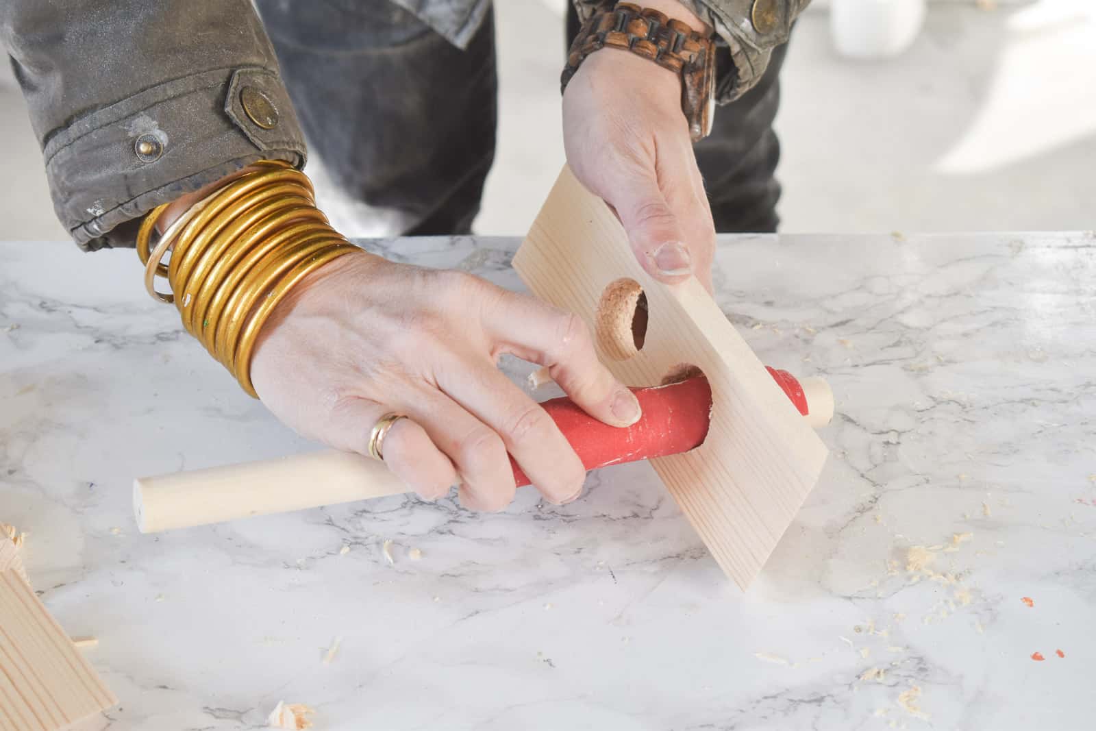 sanding the edges from drilled hole