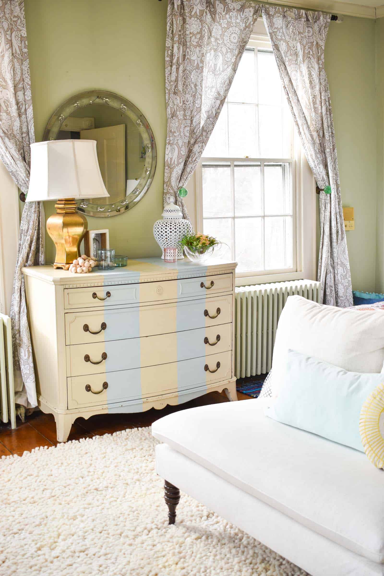 striped dresser in bedroom