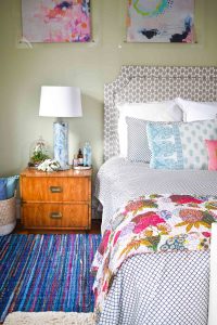 rag rug next to bed in master bedroom