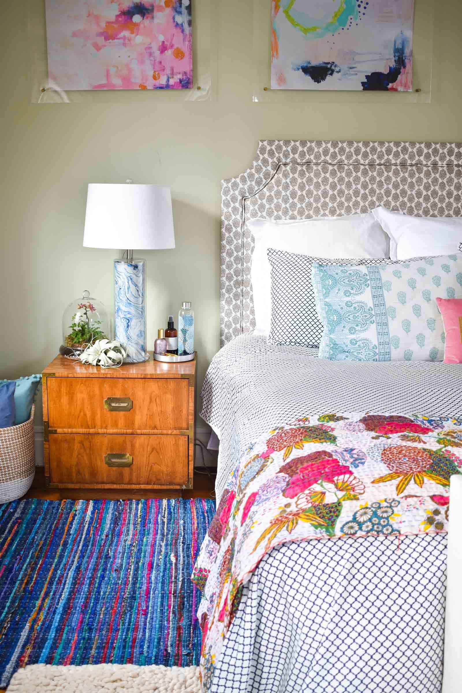 rag rug next to bed in master bedroom