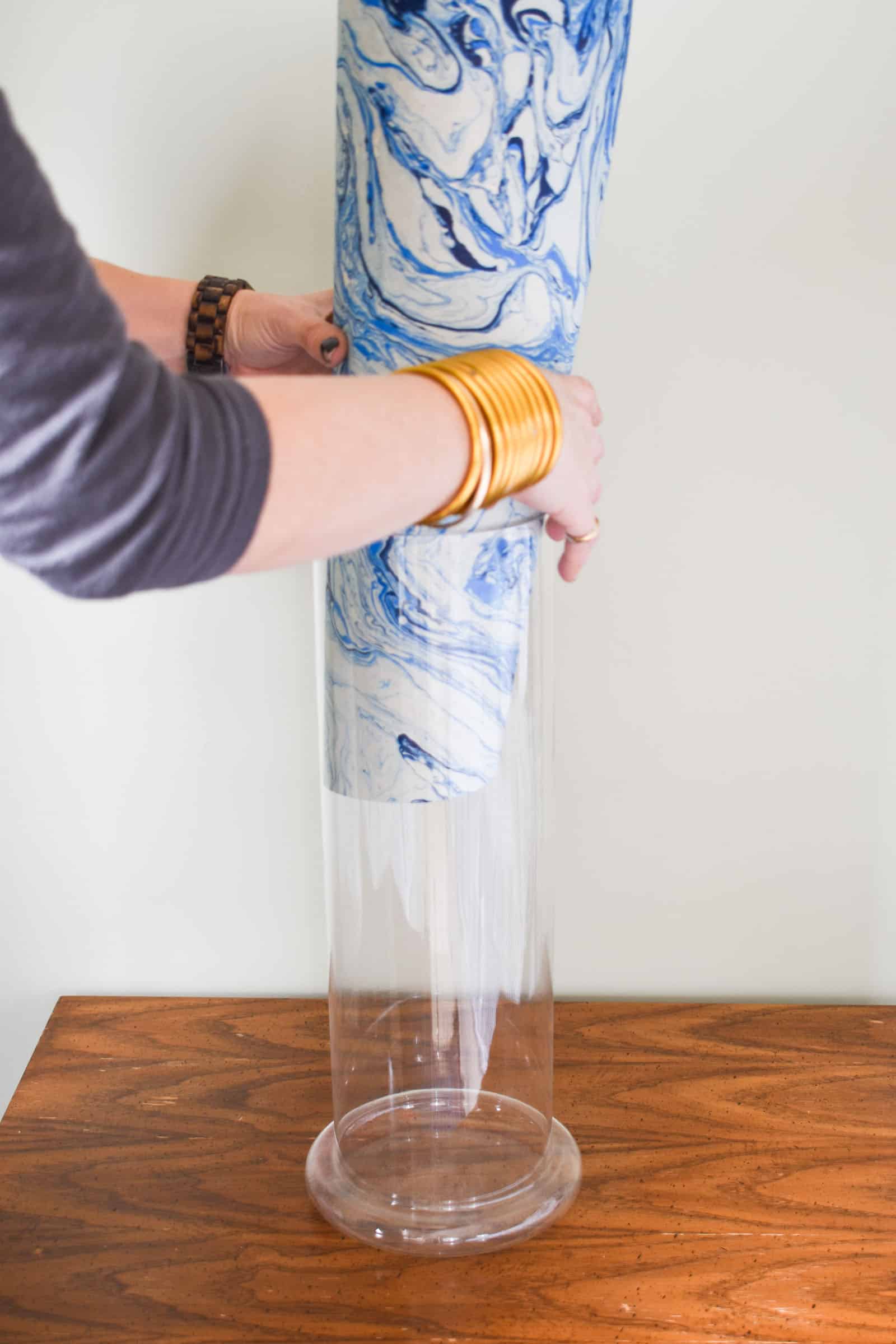 place paper into glass lamp