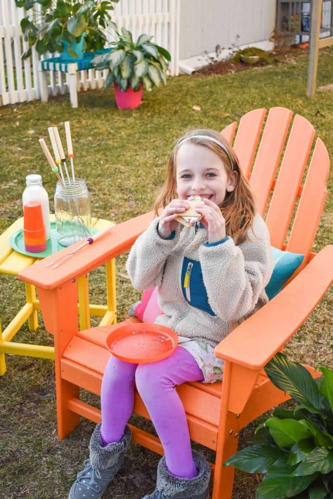 enjoying s'mores in colorful adirdonack