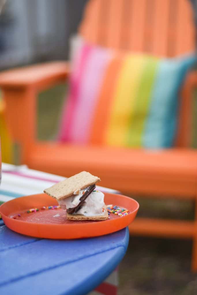 enjoying our fire pit, our rainbow furniture and s'mores