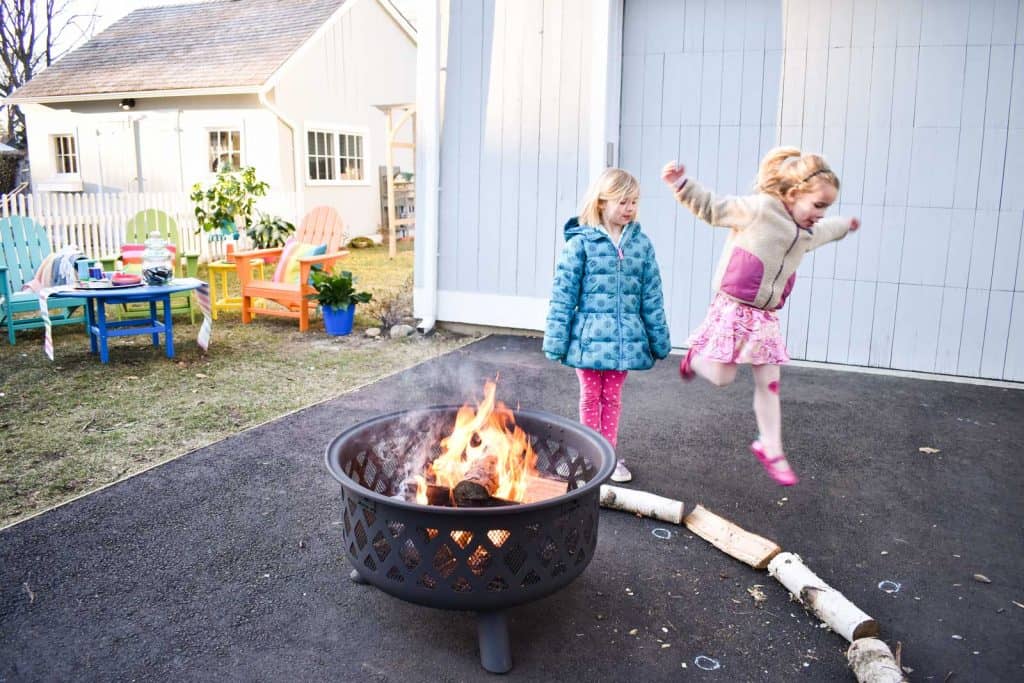 enjoying our fire pit, our rainbow furniture and s'mores