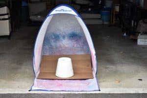 spray tent set up in garage