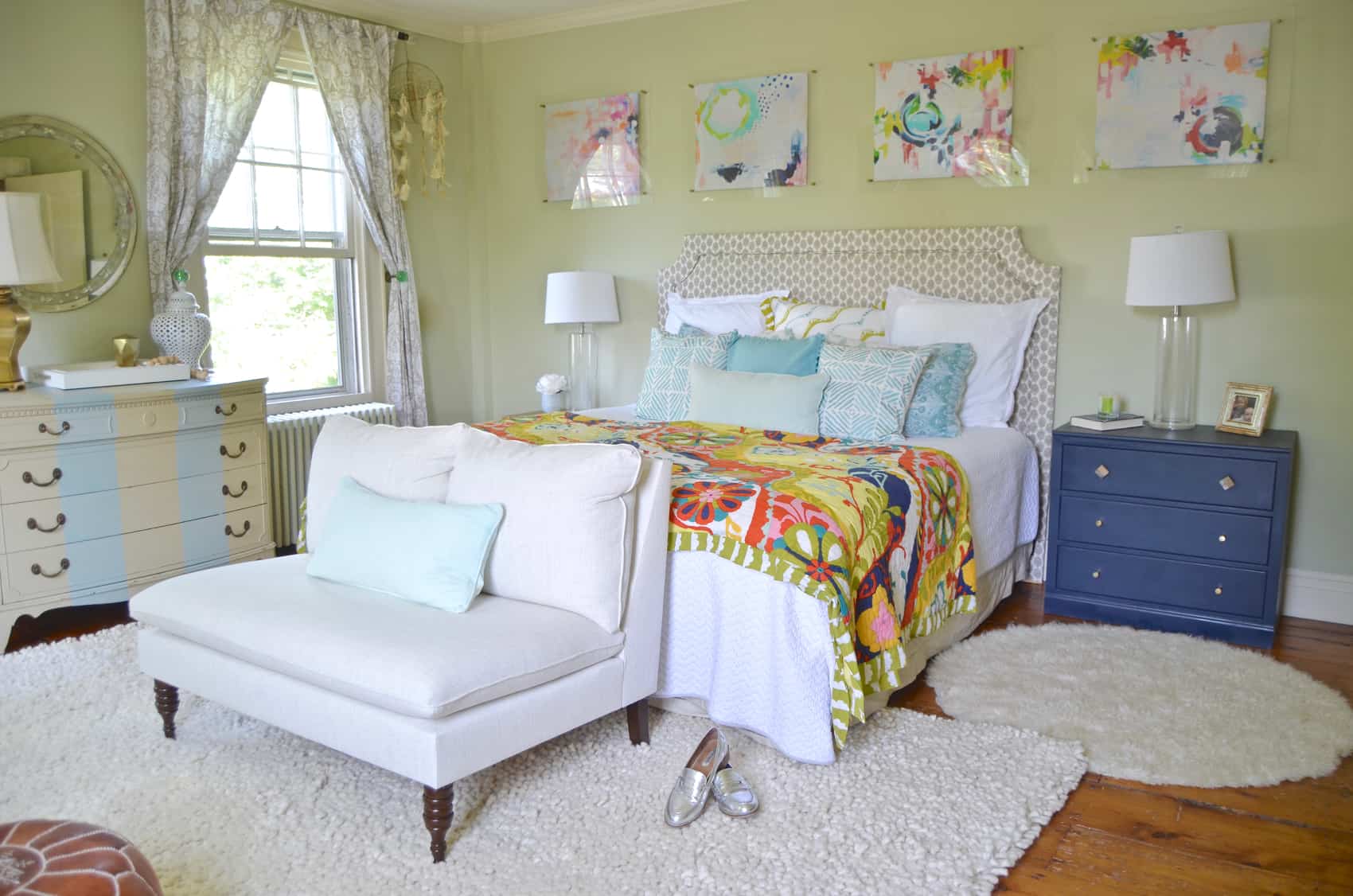 master bedroom with colorful art above the bed