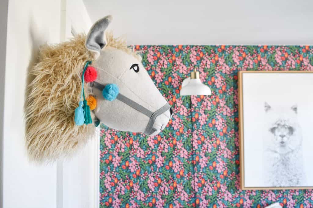 stuffed llama in guest room