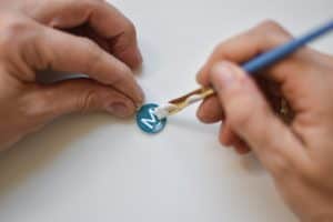 glue letter onto pendant with mod podge