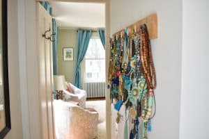 jewelry hanging on hooks before