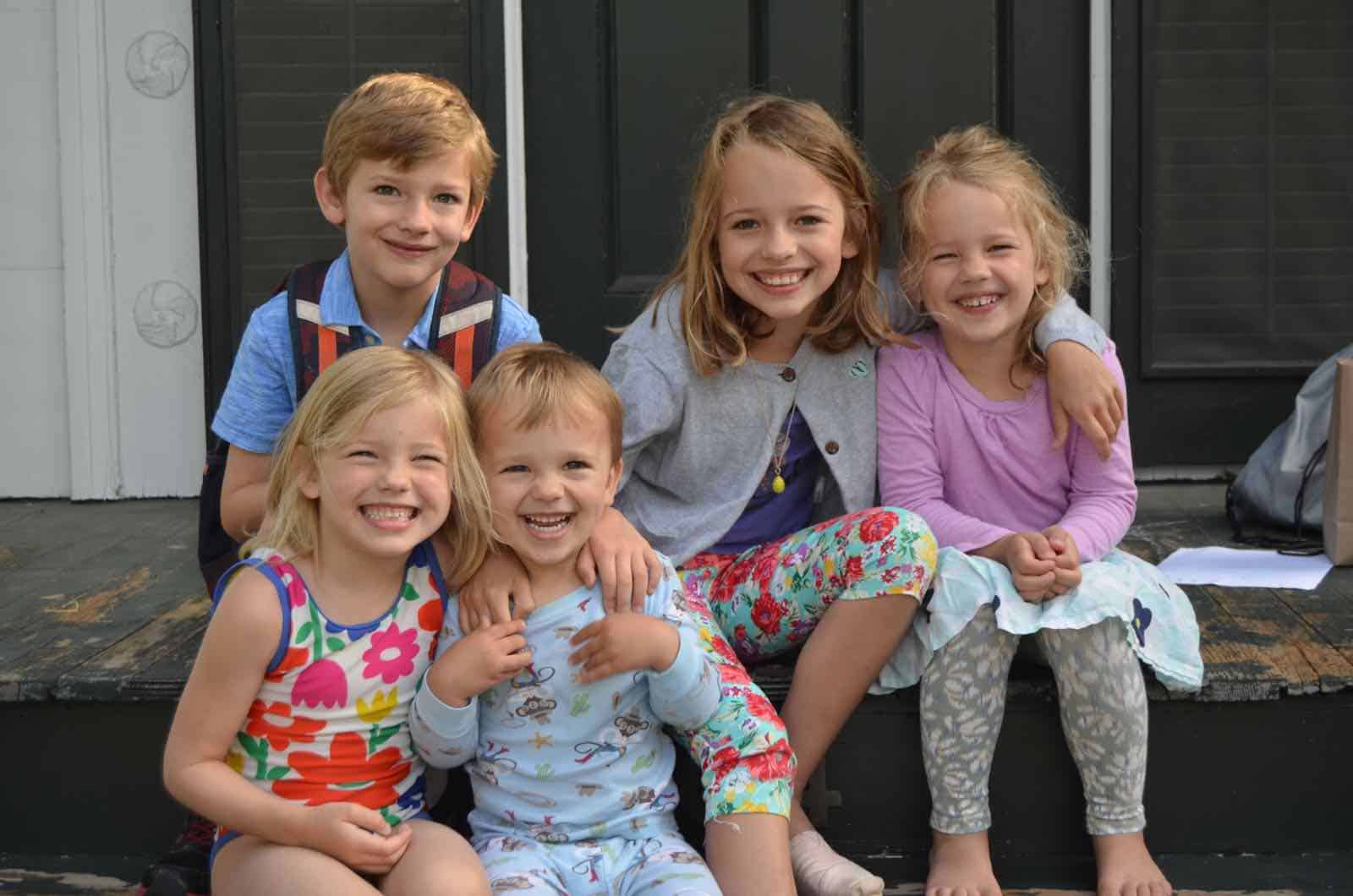 kids sitting on front porch