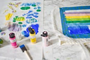 adding layers of paint to the stencil
