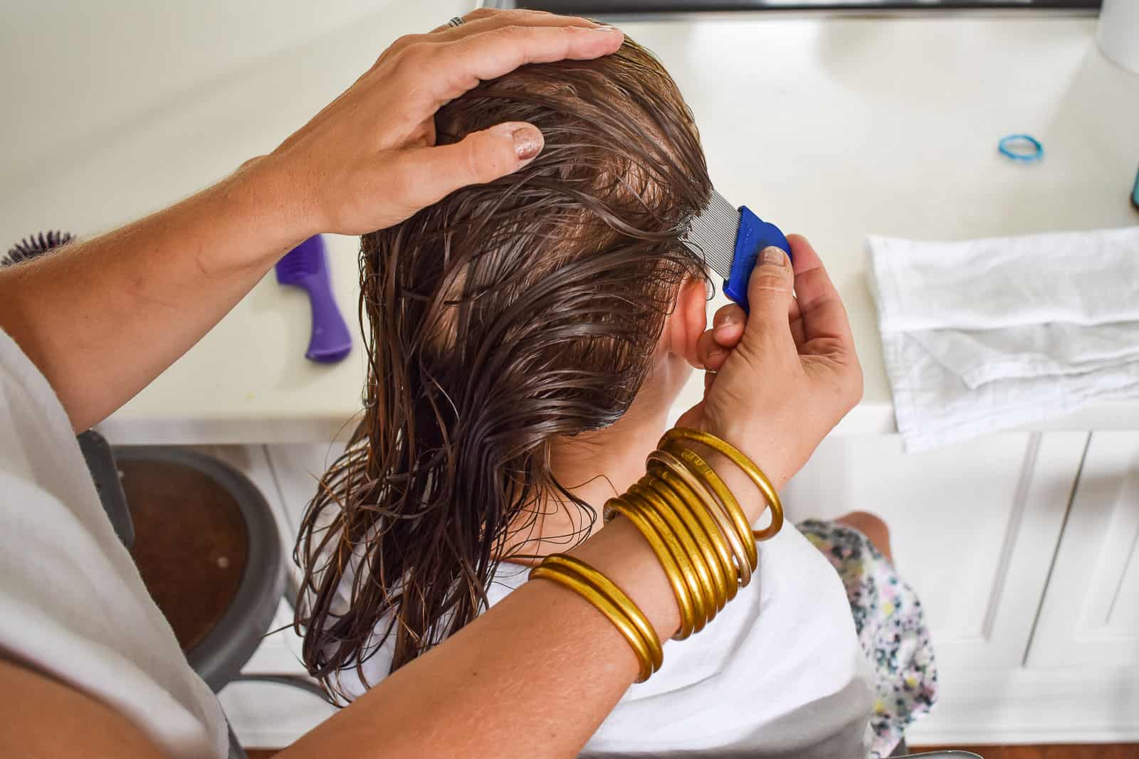 second direction for lice removal is from ear to ear