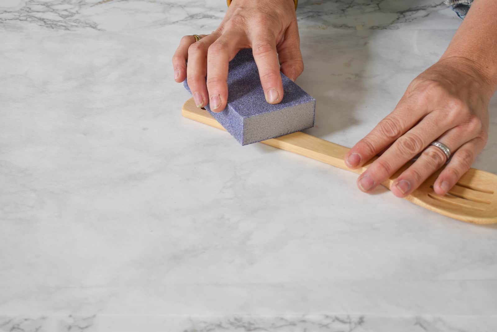 sand the handles of the cooking utensils