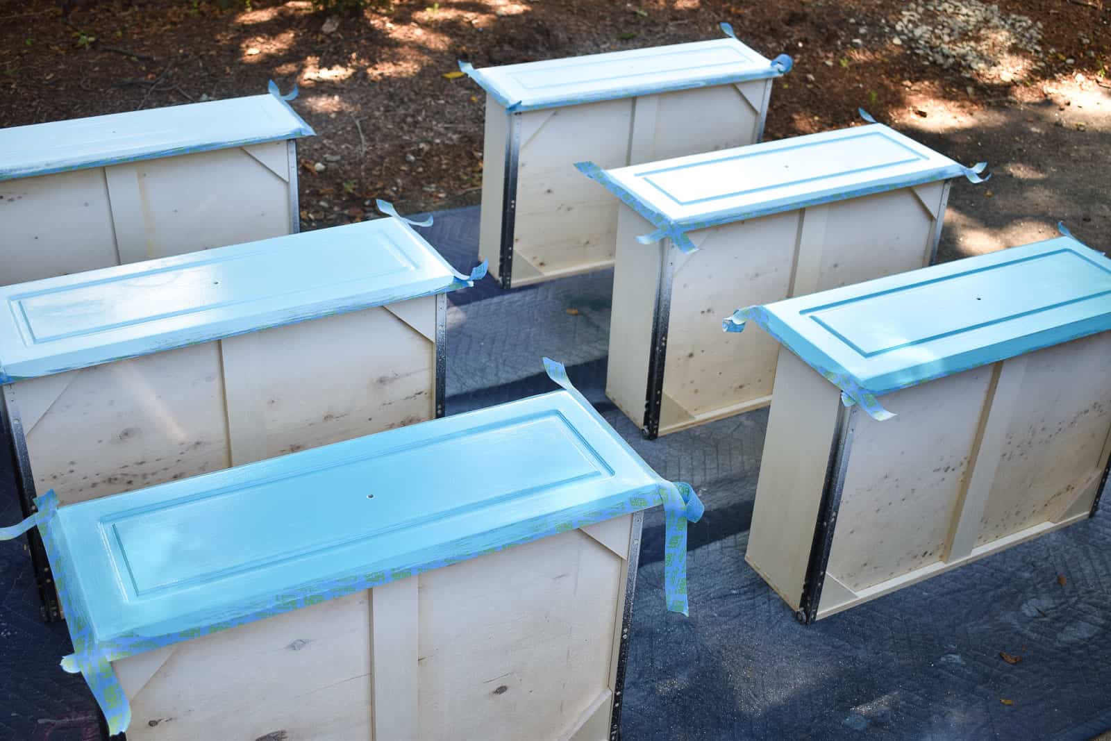 tape off the drawers and paint with three shades of blue for the ombre
