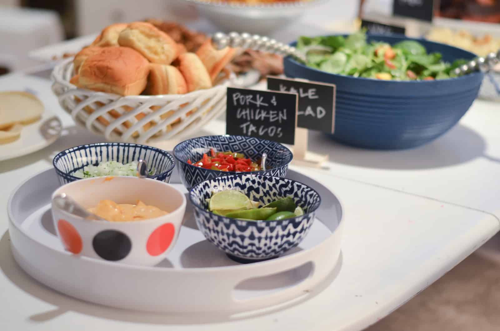 buffet table with blue salad bowl