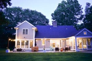 lovely home exterior with string lights and diy planter