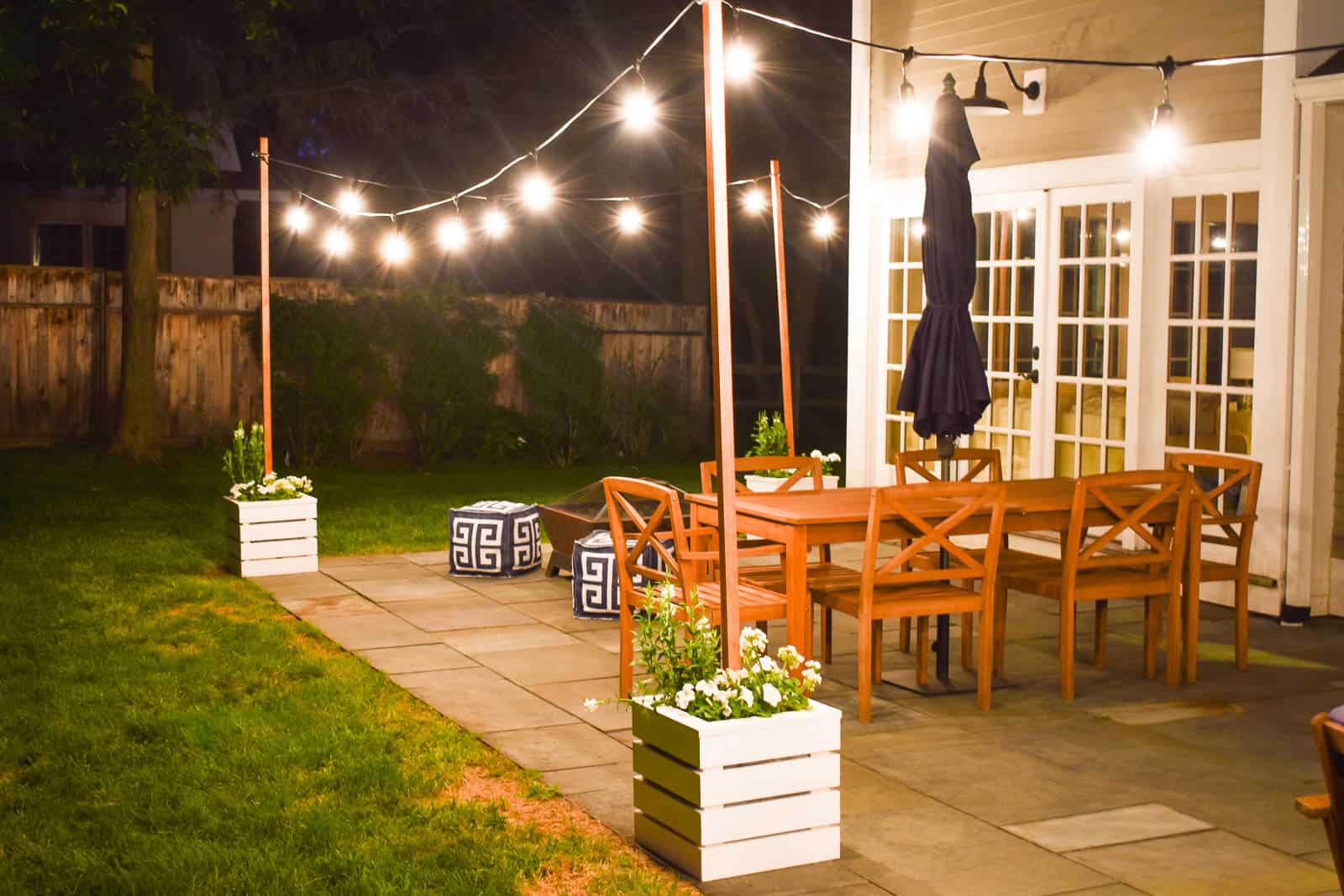 wooden planters with build in pole for hanging string lights