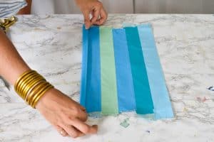 fold one length of duct tape around each side of sheet