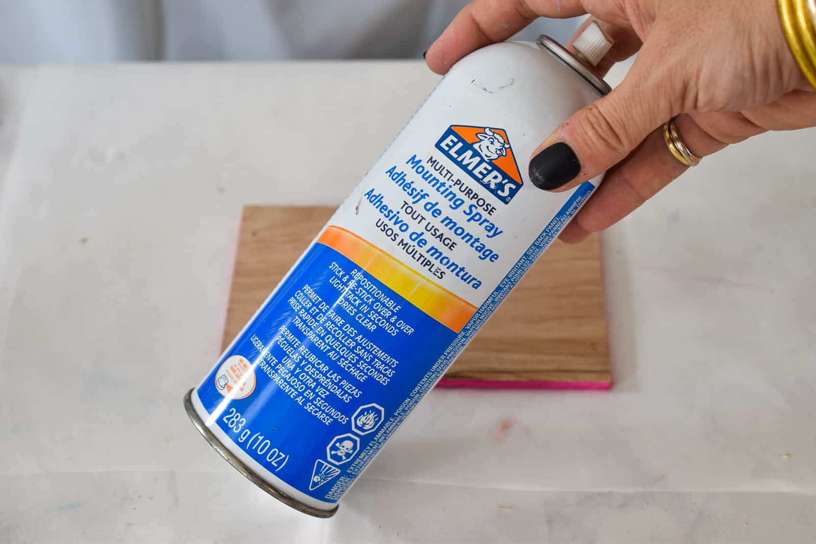 use spray adhesive to attach photos to wood