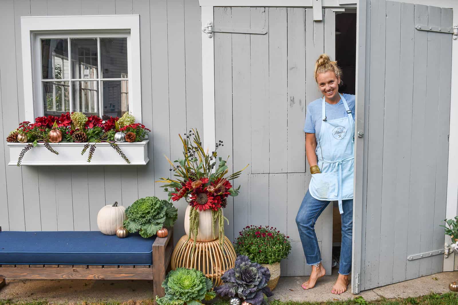 faux flowers and fall decor for outdoor shed