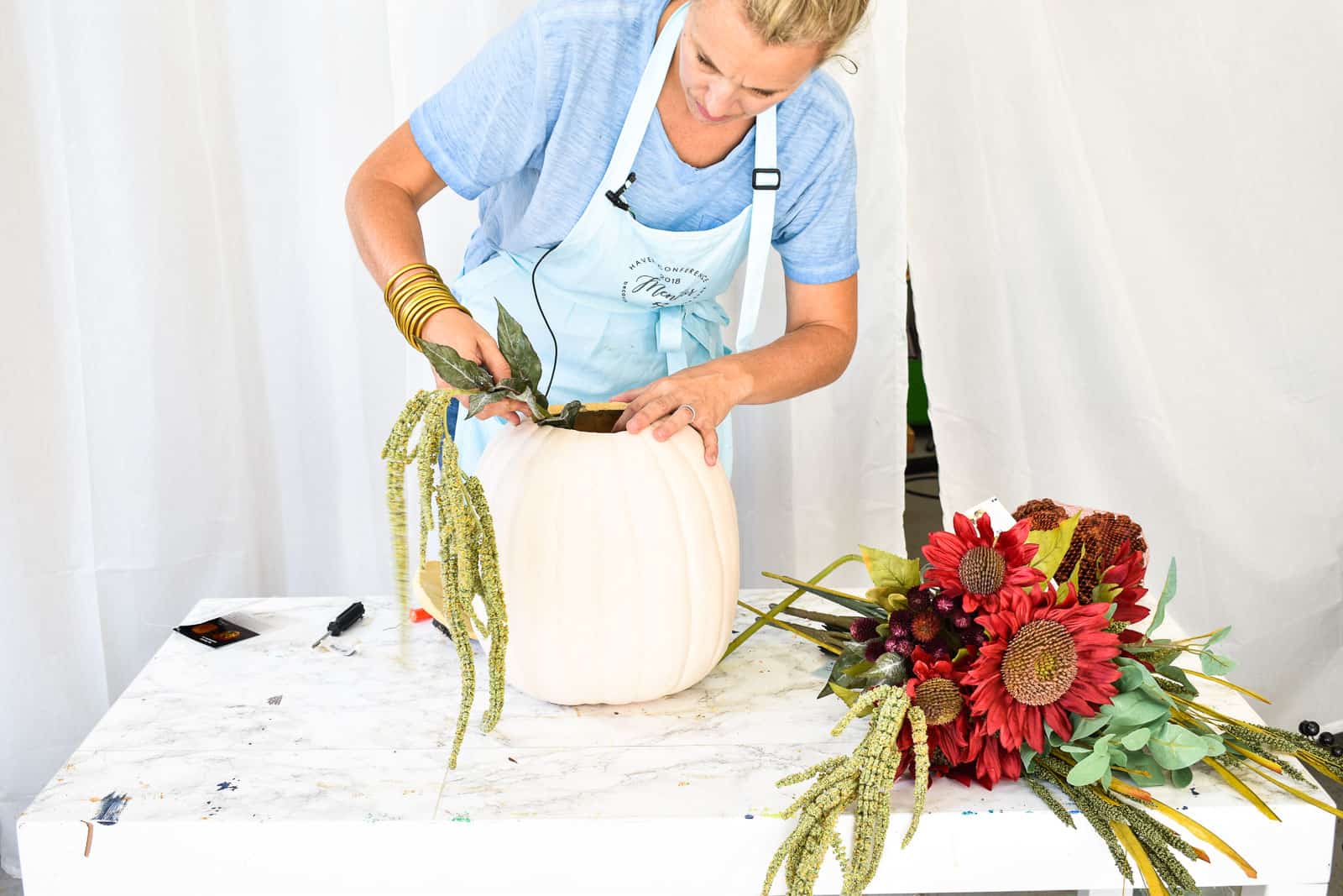 add flowers to pumpkin