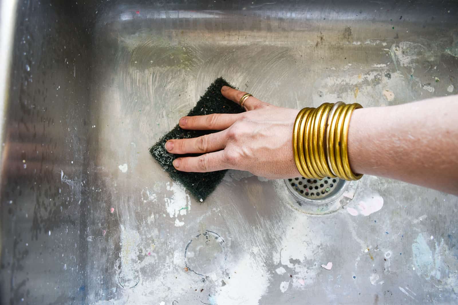 scrub paint on sink