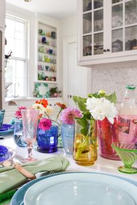 using rainbow glass to set a colorful table
