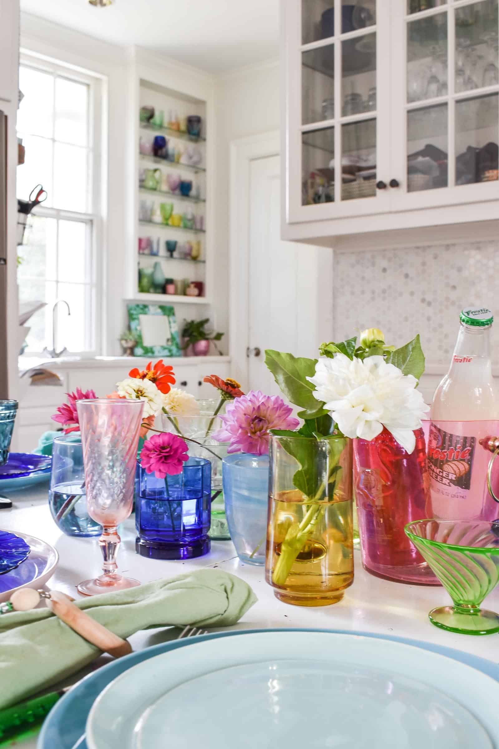 using rainbow glass to set a colorful table